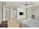 Primary bedroom showcasing a built in media center with white cabinets and access to a private balcony at 11354 Merado Peak Dr, Las Vegas, NV 89135