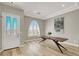 Bright and airy dining area with modern flooring, a statement table, and ample natural light at 11354 Merado Peak Dr, Las Vegas, NV 89135
