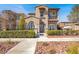 Charming two-story home with a beautiful stucco exterior and a well-maintained front yard at 11354 Merado Peak Dr, Las Vegas, NV 89135