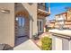 Close-up of the home's welcoming entryway featuring a stylish front door and decorative lighting at 11354 Merado Peak Dr, Las Vegas, NV 89135