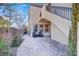 Outdoor patio featuring chairs, pavers, and well-manicured landscaping at 11354 Merado Peak Dr, Las Vegas, NV 89135