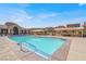 Enjoy the community pool with lounging areas and seating under the shade at 11354 Merado Peak Dr, Las Vegas, NV 89135