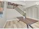View of the staircase featuring dark wood handrails, neutral paint, and an open layout at 11354 Merado Peak Dr, Las Vegas, NV 89135