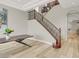 Elegant staircase with wood and iron railings complemented by modern flooring and a spacious layout at 11354 Merado Peak Dr, Las Vegas, NV 89135