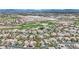 Wide aerial shot of a residential area featuring a golf course and desert landscape at 116 N Ring Dove Dr, Las Vegas, NV 89144