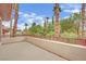 Wide balcony lined with lush trees and foliage, creating a private outdoor space at 116 N Ring Dove Dr, Las Vegas, NV 89144