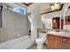 Tiled bathroom with a shower-tub combo and a vanity at 116 N Ring Dove Dr, Las Vegas, NV 89144