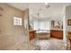 Elegant bathroom features a glass-enclosed shower and large soaking tub at 116 N Ring Dove Dr, Las Vegas, NV 89144
