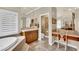 Elegant bathroom features a soaking tub, dual sinks, and vanity area at 116 N Ring Dove Dr, Las Vegas, NV 89144