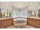 Elegant bathroom features a large soaking tub and dual sinks at 116 N Ring Dove Dr, Las Vegas, NV 89144