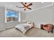 Serene bedroom features a large window providing natural light and a cozy seating area at 116 N Ring Dove Dr, Las Vegas, NV 89144