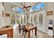 Bright dining area with shuttered windows and access to the backyard at 116 N Ring Dove Dr, Las Vegas, NV 89144