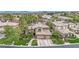 Beautiful two-story home with a three-car garage, stone driveway, and manicured front yard at 116 N Ring Dove Dr, Las Vegas, NV 89144