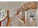 Carpeted stairs with decorative wood and wrought iron bannister at 116 N Ring Dove Dr, Las Vegas, NV 89144