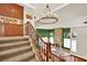 Entryway staircase view with an ornate chandelier hanging overhead at 116 N Ring Dove Dr, Las Vegas, NV 89144