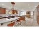 Bright kitchen with a central island with cooktop and seating, perfect for entertaining at 116 N Ring Dove Dr, Las Vegas, NV 89144