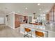 A kitchen with a breakfast bar, an island, and stainless steel appliances at 116 N Ring Dove Dr, Las Vegas, NV 89144