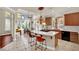 Kitchen features an island cooktop with bar seating, lots of natural light and stainless steel appliances at 116 N Ring Dove Dr, Las Vegas, NV 89144