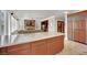 A spacious kitchen with a center island and wood cabinets at 116 N Ring Dove Dr, Las Vegas, NV 89144