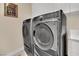 Close up on a gray front load washer and dryer at 116 N Ring Dove Dr, Las Vegas, NV 89144