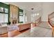 Open living room featuring a fireplace, staircase, and shuttered windows for natural light at 116 N Ring Dove Dr, Las Vegas, NV 89144