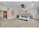 Spacious main bedroom with carpet floors and a ceiling fan at 116 N Ring Dove Dr, Las Vegas, NV 89144