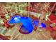 Aerial night view showcasing the pool, spa, and outdoor dining area of this exceptional backyard at 116 N Ring Dove Dr, Las Vegas, NV 89144