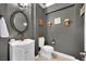 A powder room with dark gray walls and pedestal sink at 116 N Ring Dove Dr, Las Vegas, NV 89144