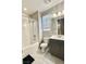 Bathroom featuring shower-tub combo with a modern vanity and tiled floors at 11703 Emerald Lake Ave, Las Vegas, NV 89138