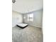 Bedroom with neutral colors, plush carpet, and natural light at 11703 Emerald Lake Ave, Las Vegas, NV 89138