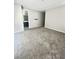 Bedroom with neutral walls and carpet, next to the modern bathroom at 11703 Emerald Lake Ave, Las Vegas, NV 89138