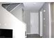 Inviting entryway with a view of the staircase, neutral walls, and direct access to the upper and lower levels at 11703 Emerald Lake Ave, Las Vegas, NV 89138