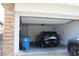 Spacious two car garage featuring a modern car, house access, and storage space at 11703 Emerald Lake Ave, Las Vegas, NV 89138