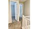 Hallway featuring access to rooms with carpeted floors at 11703 Emerald Lake Ave, Las Vegas, NV 89138