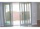 Sliding glass doors opening to a private backyard patio, offering seamless indoor-outdoor living at 11703 Emerald Lake Ave, Las Vegas, NV 89138