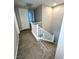 Carpeted stairs with white railing leading to the upper level at 11703 Emerald Lake Ave, Las Vegas, NV 89138