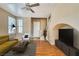 Inviting living room with wood floors, neutral paint, lots of light, and stylish furnishings at 1813 Arch Stone Ave, North Las Vegas, NV 89031