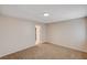 Bright bedroom featuring neutral walls, plush carpeting, and ample natural light from the doorway at 1813 Pluto Dr, Las Vegas, NV 89108