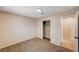 Bedroom showcasing carpet, closet with shelving, and door frame with tile at 1813 Pluto Dr, Las Vegas, NV 89108