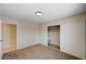 Bedroom featuring a large closet with sliding doors, plush carpet, and neutral walls at 1813 Pluto Dr, Las Vegas, NV 89108