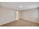 A carpeted bedroom features a standard ceiling light and access to the closet at 1813 Pluto Dr, Las Vegas, NV 89108