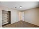Bedroom featuring carpet, closet with shelving, and a door to another room at 1813 Pluto Dr, Las Vegas, NV 89108