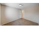 A simple bedroom with neutral paint, carpeted floor, white trim and a standard ceiling light at 1813 Pluto Dr, Las Vegas, NV 89108