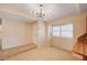 Bright dining room features tile flooring, a modern light fixture, and ample natural light at 1813 Pluto Dr, Las Vegas, NV 89108