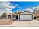 Charming single-story home with a well-maintained lawn and two-car garage in a quiet neighborhood at 1813 Pluto Dr, Las Vegas, NV 89108