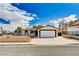 Charming single-story home featuring a spacious two-car garage and well-maintained front yard at 1813 Pluto Dr, Las Vegas, NV 89108