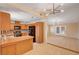 Kitchen boasts wood counters, cabinets, tile floor, and view into dining area at 1813 Pluto Dr, Las Vegas, NV 89108