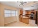 Open kitchen with modern light fixtures, stainless appliances, and wood cabinets at 1813 Pluto Dr, Las Vegas, NV 89108