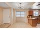 Kitchen area and breakfast nook area featuring updated lighting and cabinetry at 1813 Pluto Dr, Las Vegas, NV 89108