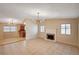 Open living room featuring tile floors, a classic brick fireplace and lots of natural light at 1813 Pluto Dr, Las Vegas, NV 89108